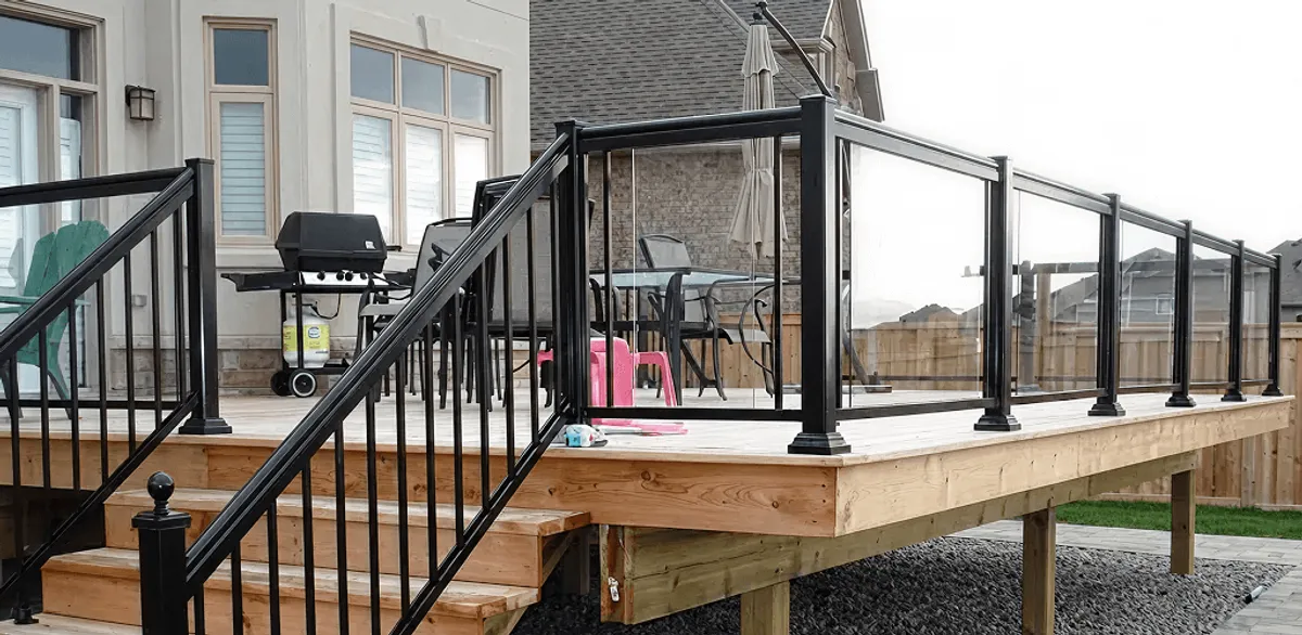Handrail installation on a deck staircase for safety and code compliance in Peoria, IL