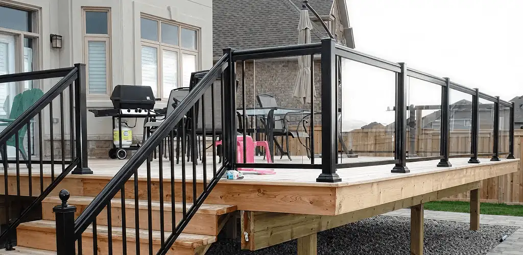 Handrail installation on a deck staircase for safety and code compliance in Peoria, IL